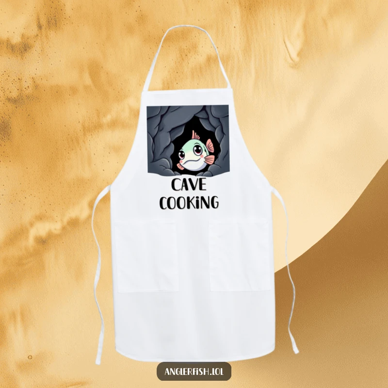 Funny anglerfish apron showing a curious creature peeking from a dark cave, practical for cooking with a humorous, deep-sea theme.