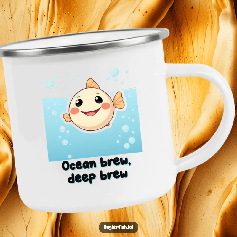 Funny enamel camping mug showcasing a happy, smiling anglerfish floating in bubbly water, built for adventure and cheerful sipping outdoors.