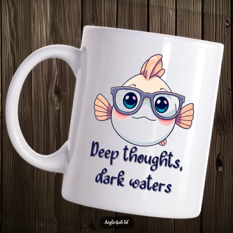 Funny anglerfish wearing large glasses, looking deeply thoughtful, sitting on a mug, perfect for a geeky gift.