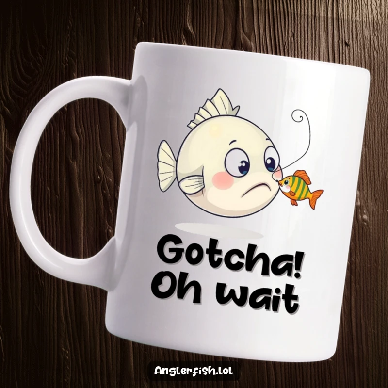 Funny anglerfish mug depicting surprise as a tiny fish playfully nibbles its lure, capturing a comical undersea encounter.