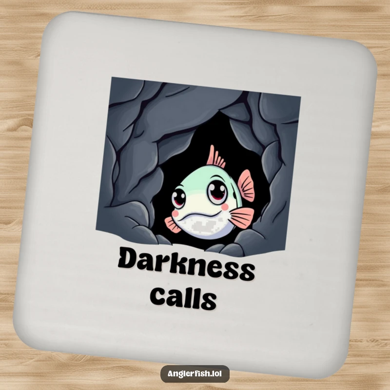 Funny anglerfish drink coaster showing a curious creature peeking from a dark cave, protecting surfaces with a humorous, aquatic theme.