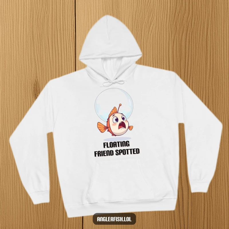 Funny anglerfish hoodie showing a surprised anglerfish encountering a giant, friendly bubble drifting by.