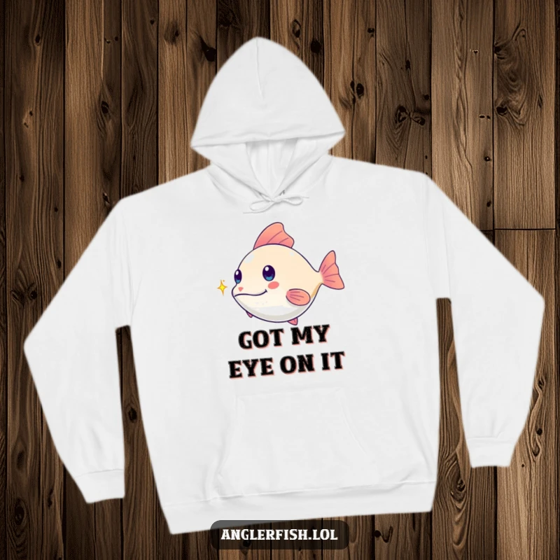 Funny kawaii anglerfish hoodie, playfully chasing a tiny shimmering spark, a warm and funny gift for ocean explorers.