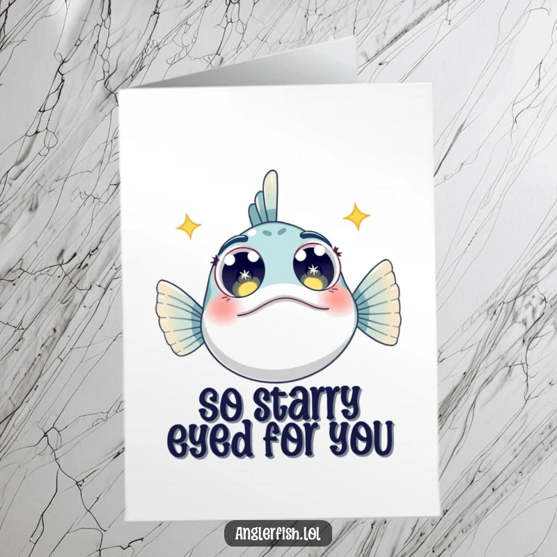 Charming free printable anglerfish thank you card featuring an anglerfish looking upwards with wide, sparkling, starry eyes.