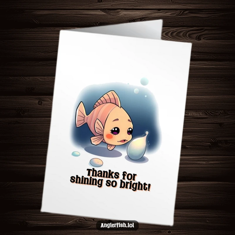 Funny free printable anglerfish thank you card, a curious fish looking at a shiny object in the deep.
