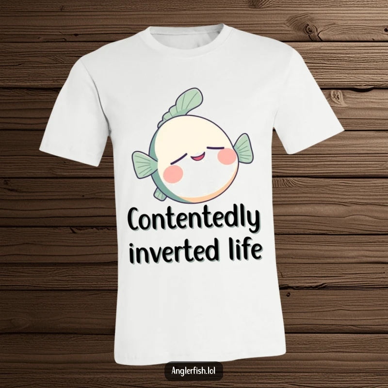 Funny anglerfish t-shirt showing a sleepy anglerfish floating upside down with a serene, contented smile.