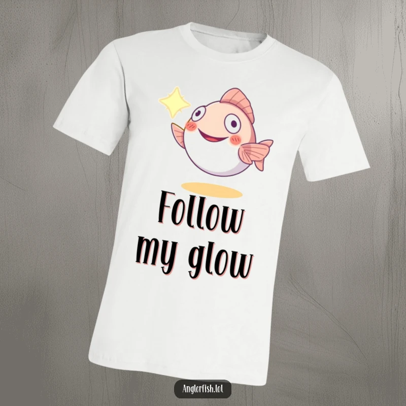 Funny anglerfish t-shirt showing a smiling creature offering its bioluminescent lure to light up the darkness, a symbol of hope.