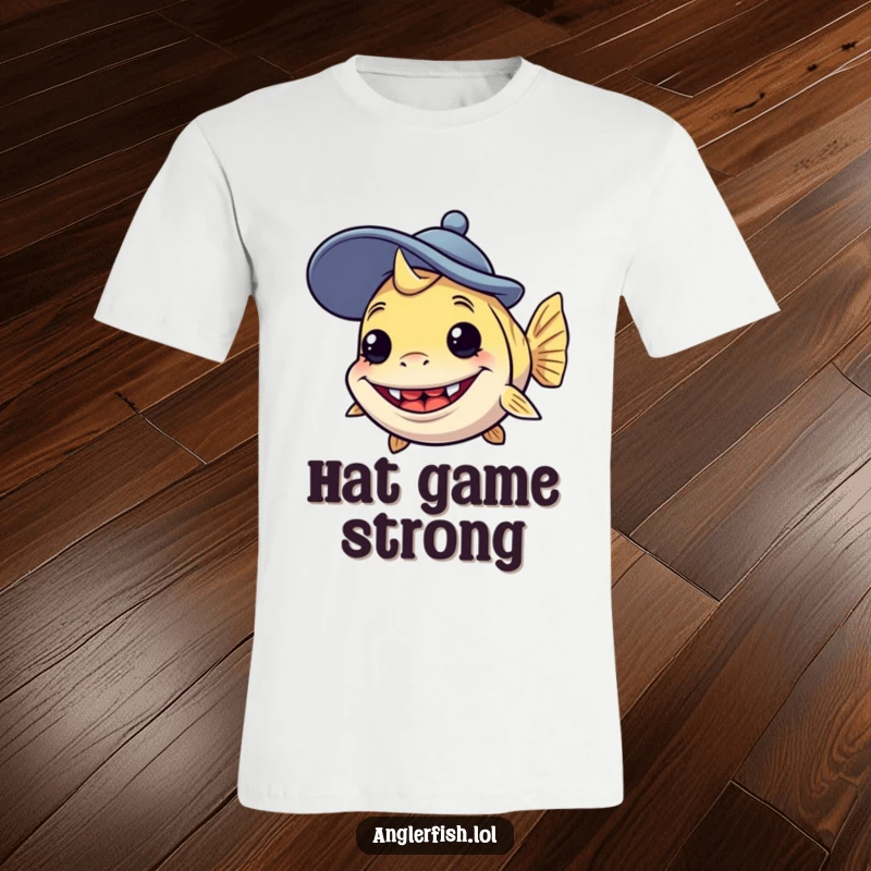 Funny anglerfish t-shirt depicting a creature with a silly grin wearing a comically oversized, goofy hat, perfect for fun fashion.