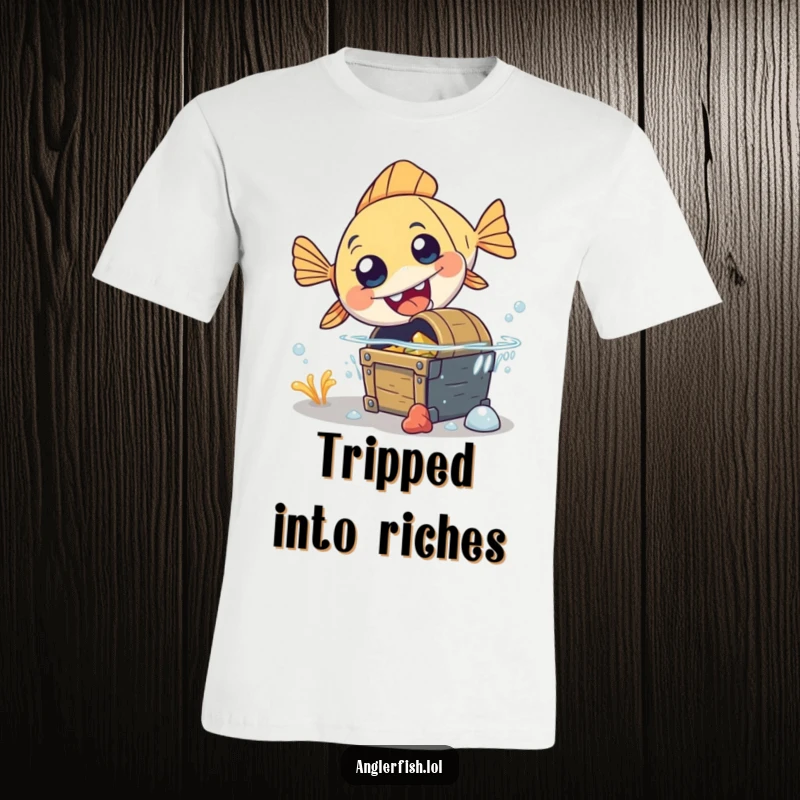 Funny anglerfish t-shirt illustrating a clumsy anglerfish tripping over a treasure chest, capturing a moment of surprise.