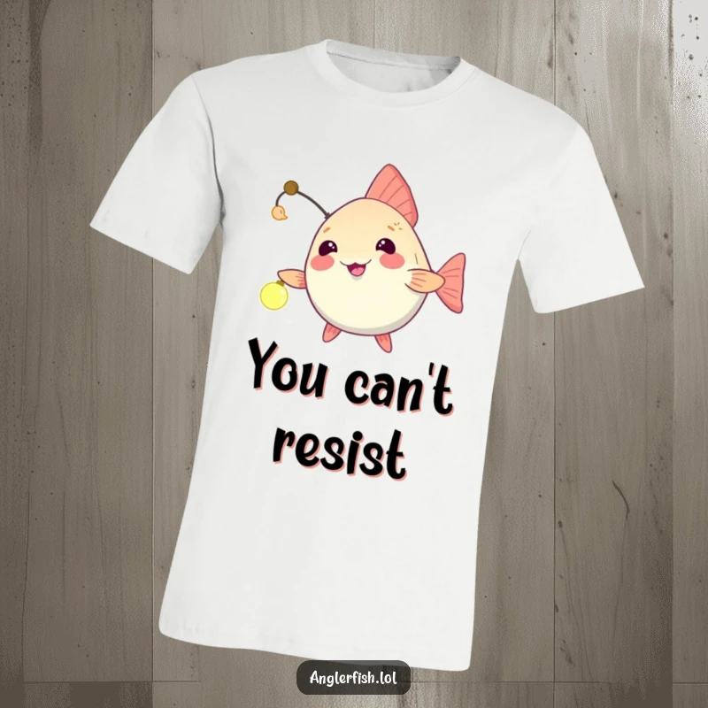 Funny anglerfish t-shirt with a light being playfully dangled, inviting an unseen friend closer with a humorous gesture.